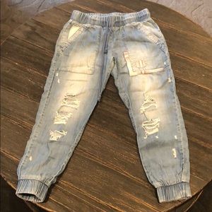 Woman’s distressed denim jogger pants